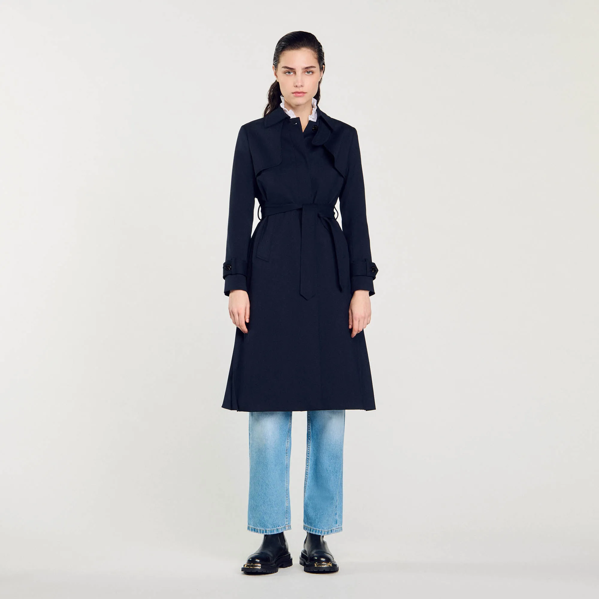 Trench coat with pleated inset