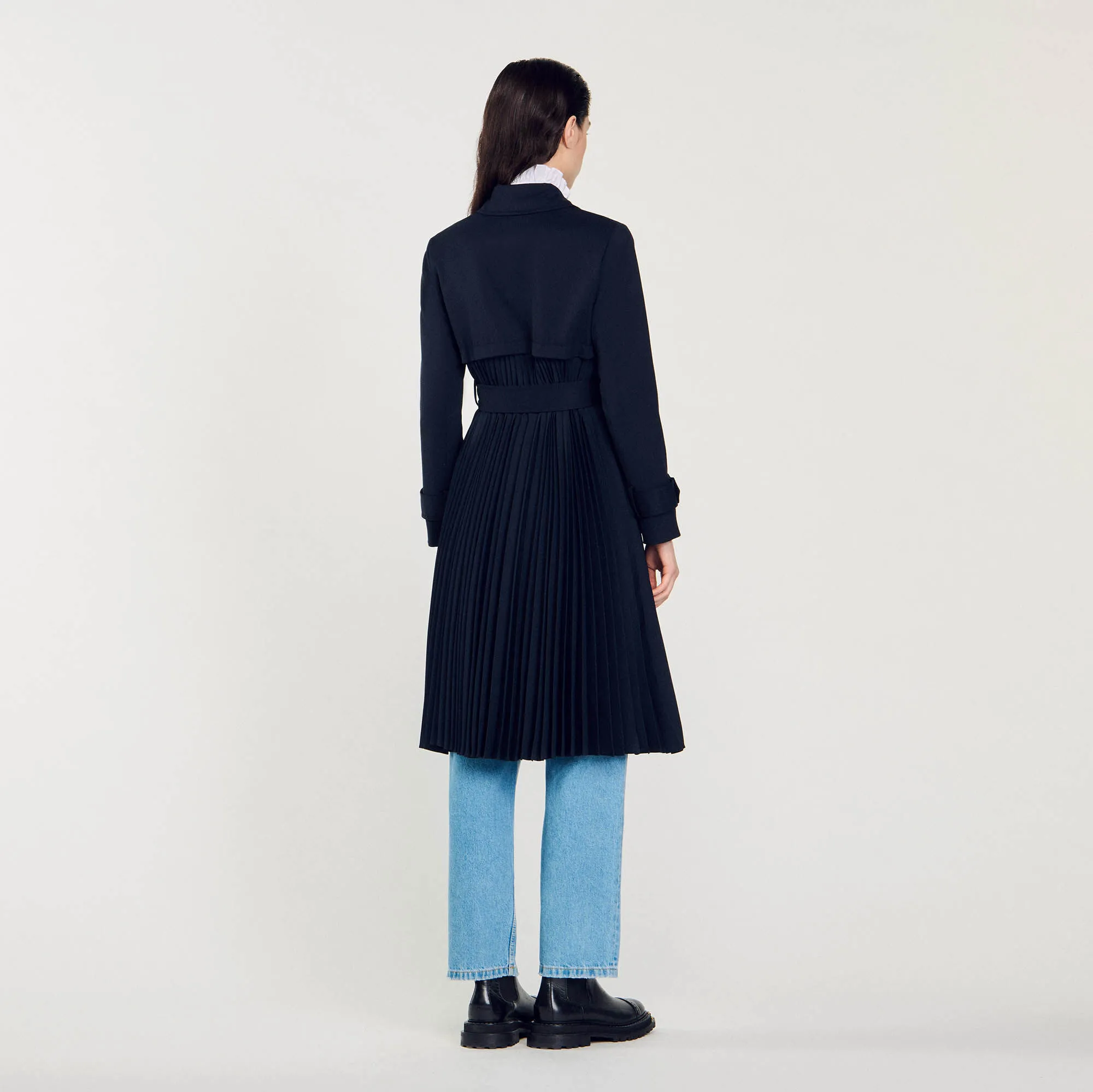 Trench coat with pleated inset